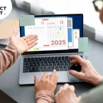 Elderly couple discussing a 2025 moving calendar on a laptop screen branded, highlighting optimal dates for affordable Melbourne removalists and off-peak moves.